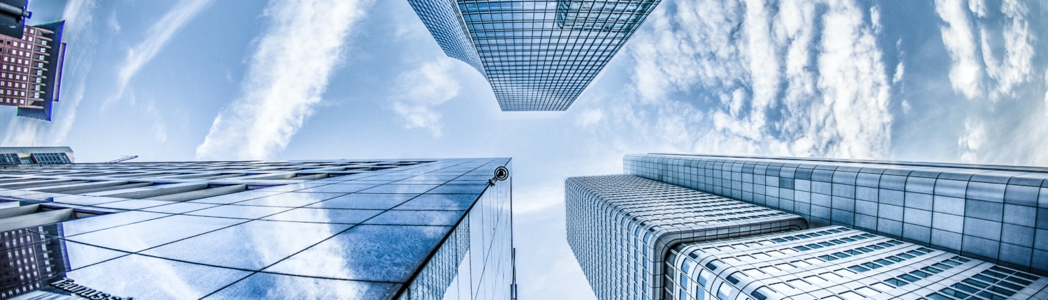 looking up at sky scrapers from the POV of someone down below, birds eye view effect.